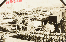 View of Gunsan port with piles of straw rice bags