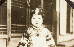 A child dressing up for New Year