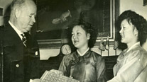 Delivery ceremony of stamps bearing the Korean flag. From left: U.S. Postmaster General Frank C. Walker, twin daughters of Yi Wonsun, Marian and Lilian